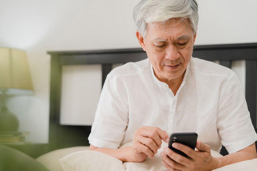 Older man using phone